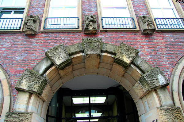Carvings above archway on "Die Zeit" building. Hamburg, Germany.