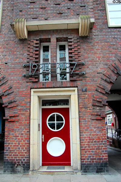 Entrance between archways to unit in brick building at Steinstraße & Mohlenhofstraße. Hamburg, Germany.
