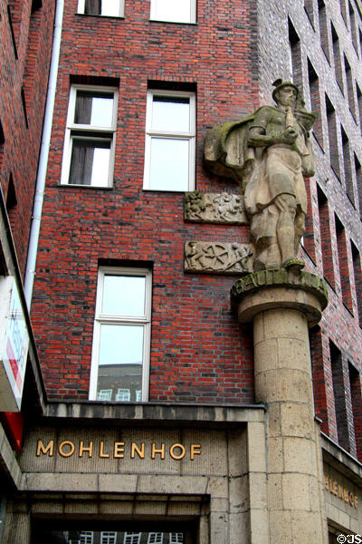 Mercury statue on Mohlenhof flanked by symbols representing the five continents by Richard Kuöhl. Hamburg, Germany.
