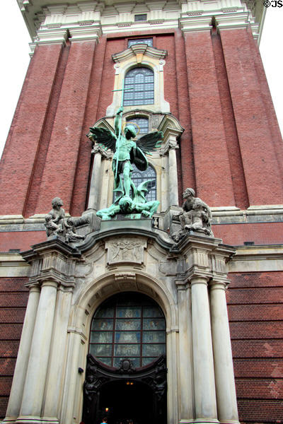 St Michael's Victory over the Devil sculpture above the main entrance to St Michael's Church. Hamburg, Germany.
