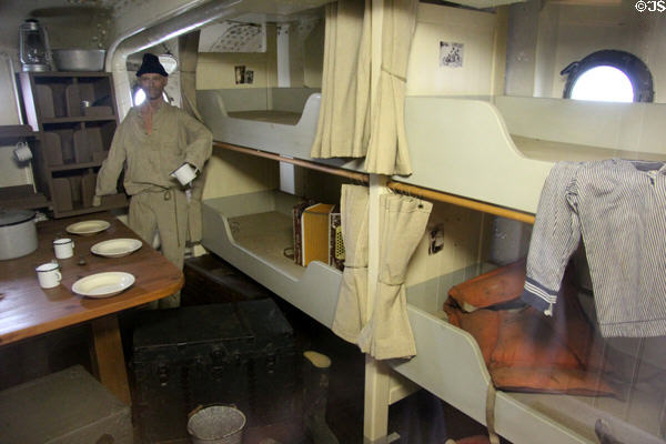 Bunks & eating table for crew on board Rickmer Rickmers museum sailing ship. Hamburg, Germany.