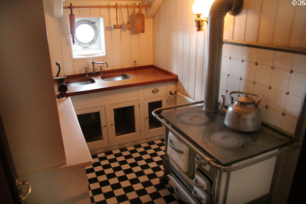 Stove with railing to prevent pots from sliding off in rough weather on board Rickmer Rickmers museum sailing ship. Hamburg, Germany.