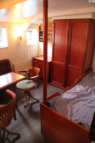 Officer bedroom with work table on board Rickmer Rickmers museum sailing ship. Hamburg, Germany.