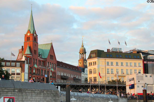 Swedish Gustav Adolf Church with tower of St Michael's church beyond seen from where Ditmar-Koel-Straße meets Elbe River. Hamburg, Germany.