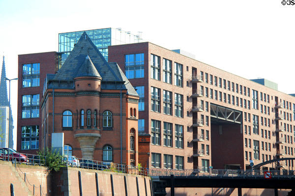 Vintage Harbor Police Station against backdrop of modern buildings in HafenCity district. Hamburg, Germany.