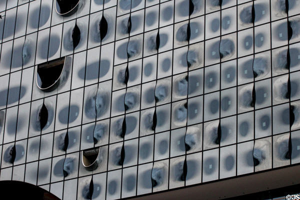 Glass facade of Elbphilharmonie concert hall (2017) on Grasbrook Peninsula of Elbe River in HafenCity. Hamburg, Germany.