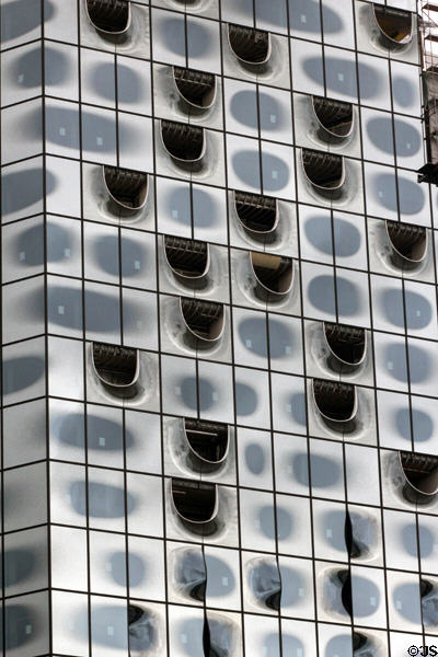 Glass facade of Elbphilharmonie concert hall (2017) on Grasbrook Peninsula of Elbe River in HafenCity. Hamburg, Germany.