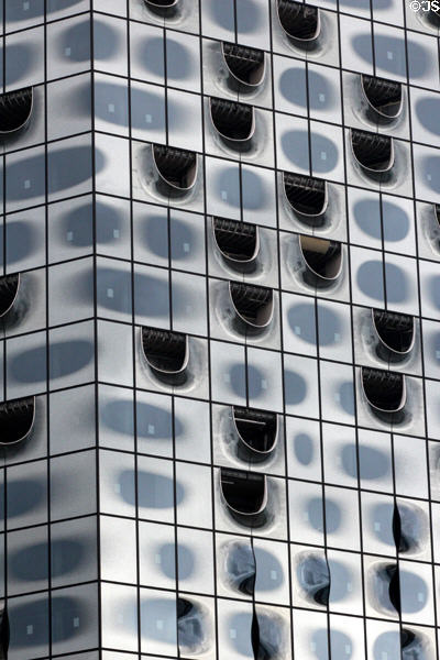 Glass facade of Elbphilharmonie concert hall (2017) on Grasbrook Peninsula of Elbe River in HafenCity. Hamburg, Germany.