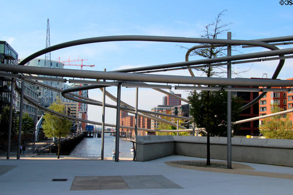 Abstract modern sculpture on bridge crossing over canal in HafenCity. Hamburg, Germany.