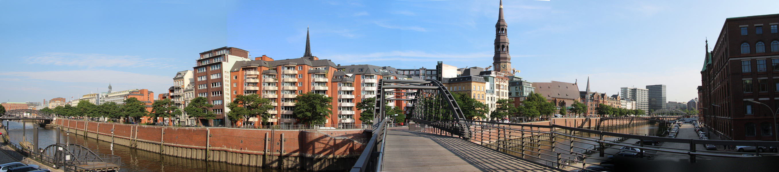 Panorama around Kibbelsteg brücke over Zollkanal with St Catherine's Church tower. Hamburg, Germany.
