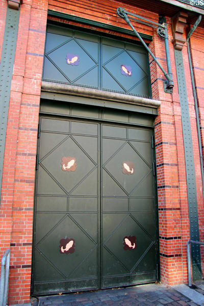 Loading doors with fish motif & winch at Hamburg Fish Market. Hamburg, Germany.
