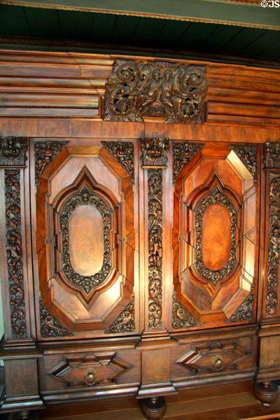 Carved walnut hall cupboard aka "Hamburger Schapp" (c1680) usually placed in entrance hall of a North German town house at Hamburg History Museum. Hamburg, Germany.