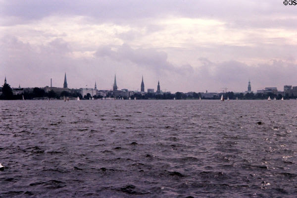 Hamburg skyline across the Aussenalster Lake punctuated by the city's five spires. Hamburg, Germany.