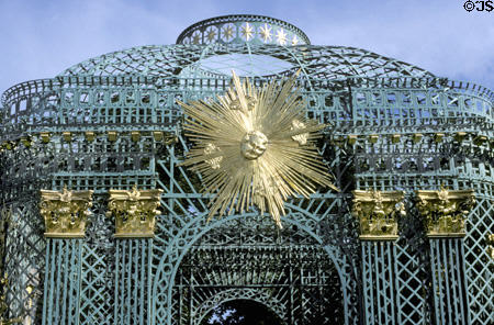 Gold & blue lacework pergola at Sanssouci Palace with sunshine face. Potsdam, Germany.