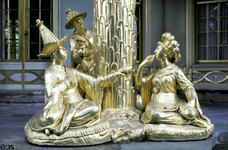 Gold Chinese figures sitting at base of Chinese Teahouse. Potsdam, Germany.