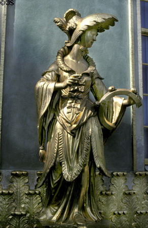 Gold Chinese woman with bells on Chinese Teahouse. Potsdam, Germany.