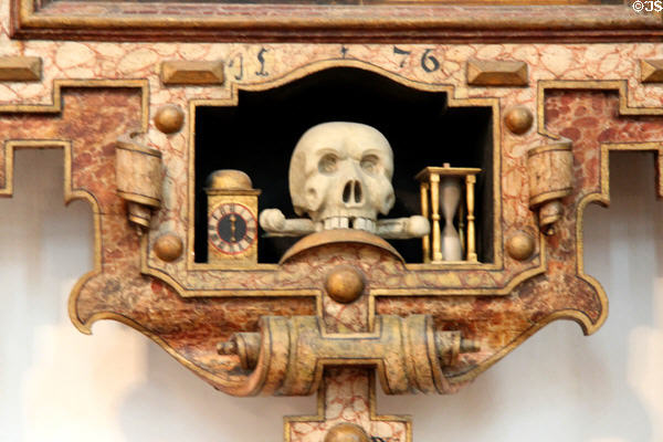Carved stone tomb memorial (1576) with skeleton & hour glass at Frauenkirche. Munich, Germany.