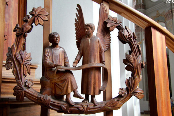 Modern pulpit carving of Evangelist St Matthew with angel symbol at Heilig-Geist-Kirche. Munich, Germany.