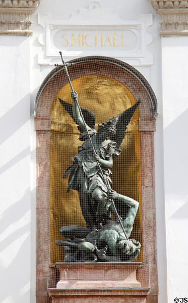 St Michael slaying dragon sculpture at St Michael Kirche. Munich, Germany.