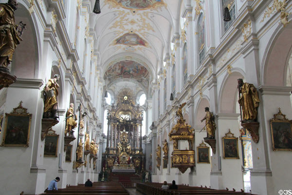 Sculpted saints along nave at Peterskirche. Munich, Germany.