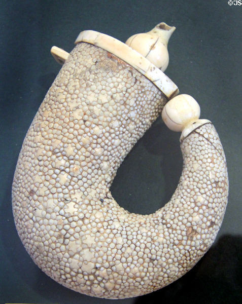 German powder flask (18thC) of wooden from covered with ray skin & capped by ivory at German Hunting & Fishing Museum. Munich, Germany.