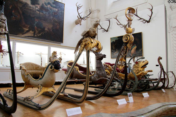 Collection of carved horse-drawn snow sledges at German Hunting & Fishing Museum. Munich, Germany.