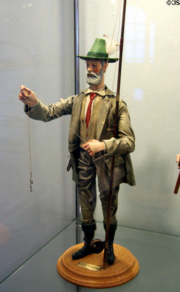 Carved figure of fly fisherman dressed for c1910 at German Hunting & Fishing Museum. Munich, Germany.