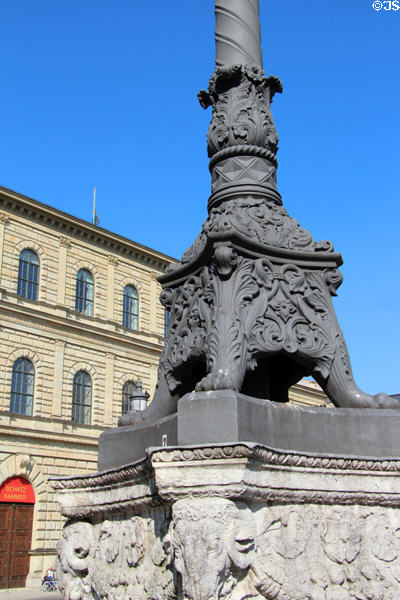 Lampstand detail on plaza before Munich Residenz. Munich, Germany.