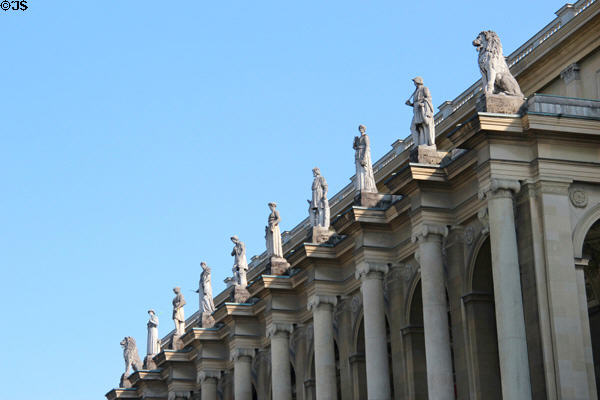 Row of Greek god statues on Munich Residenz over garden courtyard. Munich, Germany.