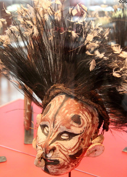 Over modeled skull with cassowary feathers from Sepik River of Papua New Guinea at Five Continents Museum. Munich, Germany.