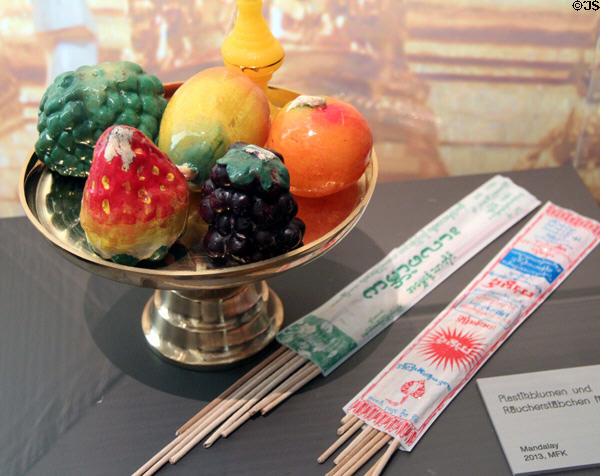 Plastic altar offering from Myanmar at Five Continents Museum. Munich, Germany.