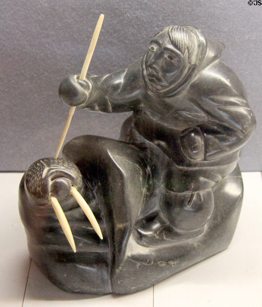 Carved soapstone hunter with walrus (late 20thC) from Northern Canada at Five Continents Museum. Munich, Germany.