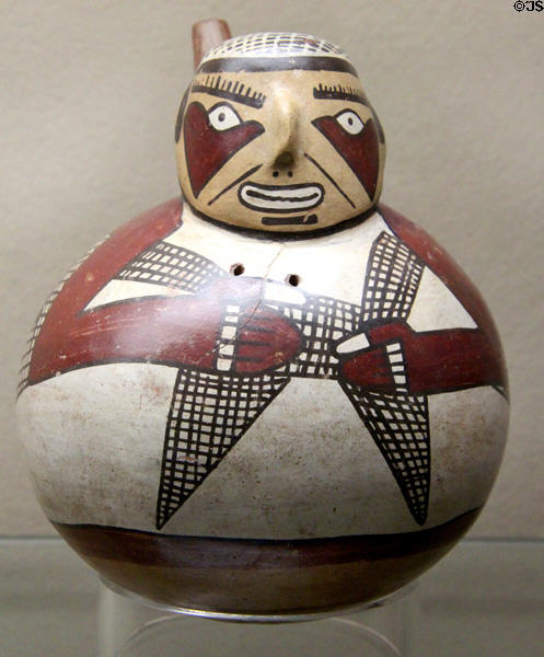 Nazca culture ceramic vessel in shape of native painted with fishing net (100-700 CE) from southern coast of Peru at Five Continents Museum. Munich, Germany.