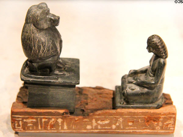 Egyptian stone & wood statue of scribe & baboon-shaped god Thot (c1450-1280 BCE) (New Kingdom, 18th-19th Dynasty) at Neues Museum. Berlin, Germany.