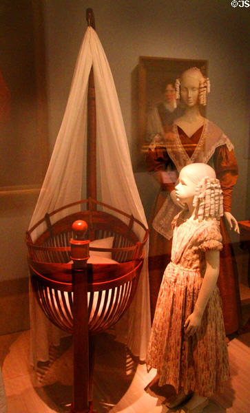 Biedermeier-style cradle (1820-30) from southern Germany at German Historical Museum. Berlin, Germany.