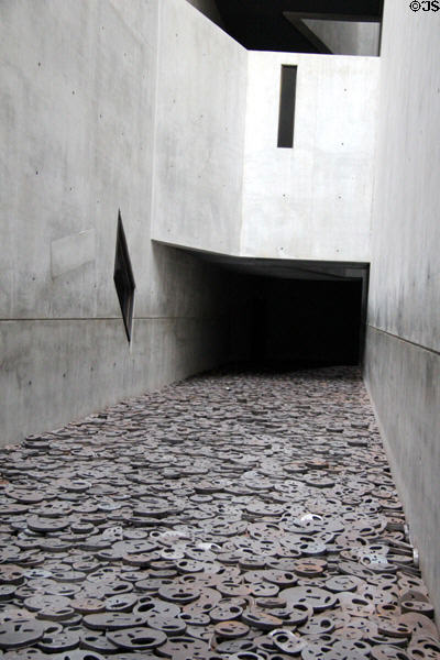 Symbolic faces of victims in void at Jewish Museum Berlin. Berlin, Germany.