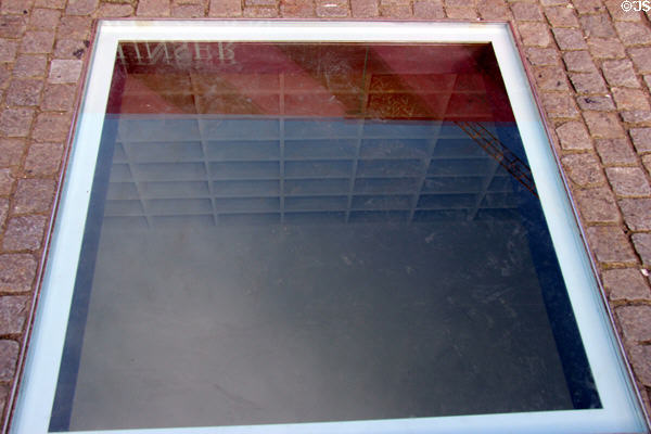 Below ground monument of empty bookshelves marking spot at Humboldt University where Nazis held book burnings on May 10, 1933. Berlin, Germany.