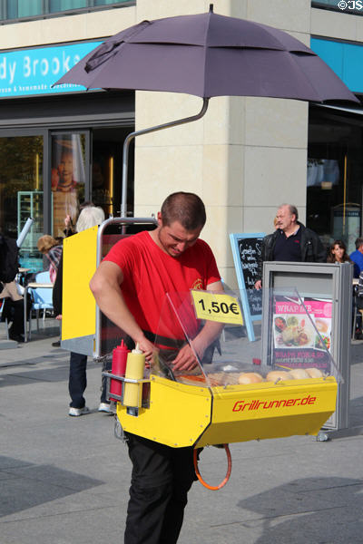 Walking mobile wurst vendor grill complete with umbrella. Berlin, Germany.