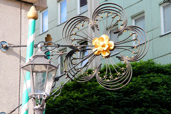 Shop sign in form of flower in Nikolaiverteil. Berlin, Germany.