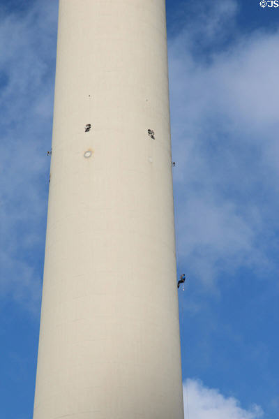 Worker climbs Berlin Television Tower. Berlin, Germany.