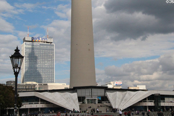 Base of Berlin Television Tower with tower's shadow on Park Inn. Berlin, Germany.