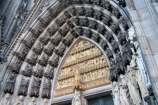Carvings of biblical stories from Adam & Eve to Christ above central west entrance doors to Köln Cathedral. Köln, Germany.