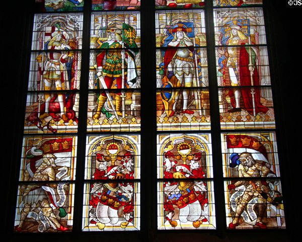 Stained glass windows depicting knights in medieval Germanic dress in Köln Cathedral. Köln, Germany.