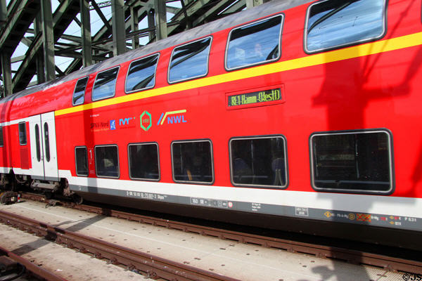 Double decker passenger train on Hohenzollern Bridge. Köln, Germany.
