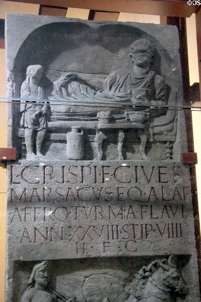 Gravestone inscription & carving of man dining in Roman fashion at Roman Germanic Museum. Köln, Germany.