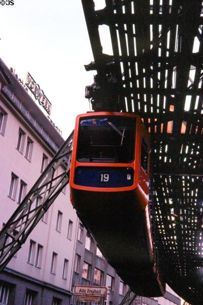 Hanging monorail passes city businesses. Wupperthal, Germany.