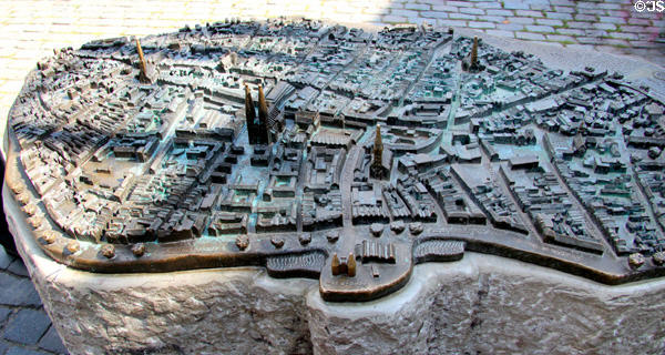 Bronze tourist 3D map of Lübeck on city sidewalk. Lübeck, Germany.