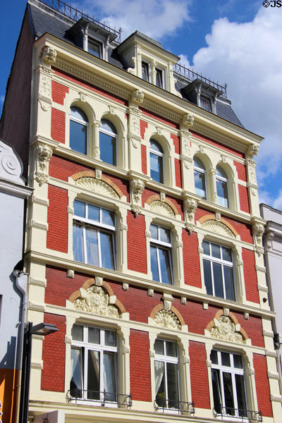 Heritage building with carvings in arches (Mühlenstraße 11). Lübeck, Germany.