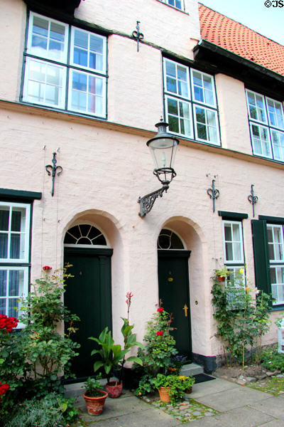 Apartment doorways at Füchtings Courtyard. Lübeck, Germany.