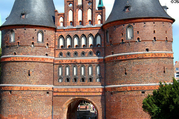 Archway leading through towers & over bridge into Lübeck via Holsten Gate. Lübeck, Germany.